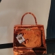 AT059Q, The Kelly, by Tessi, orange chrome, 35x12x34cm.